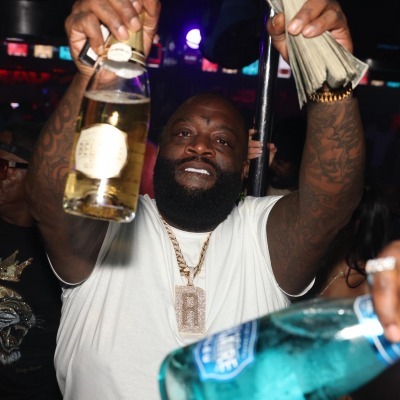 Rick Ross party having champagne at Bobby Trap On The River